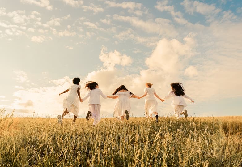 Girls are running across the field