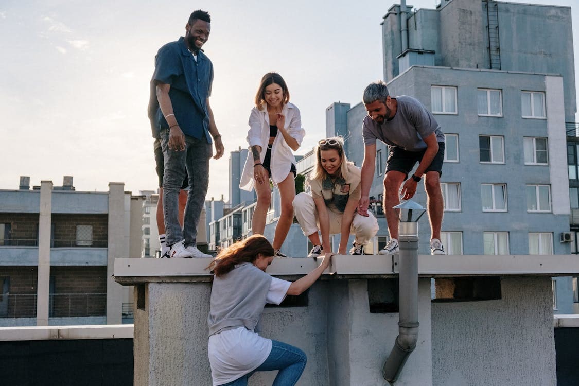 People climb onto the roof