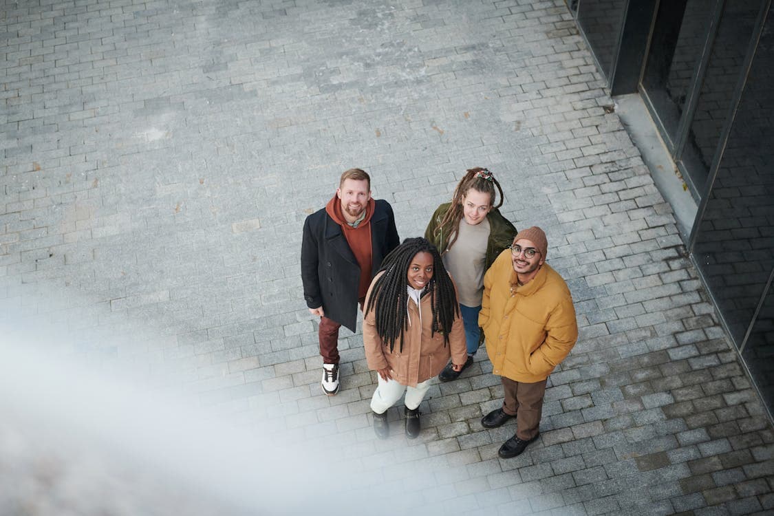 People on the sidewalk look up